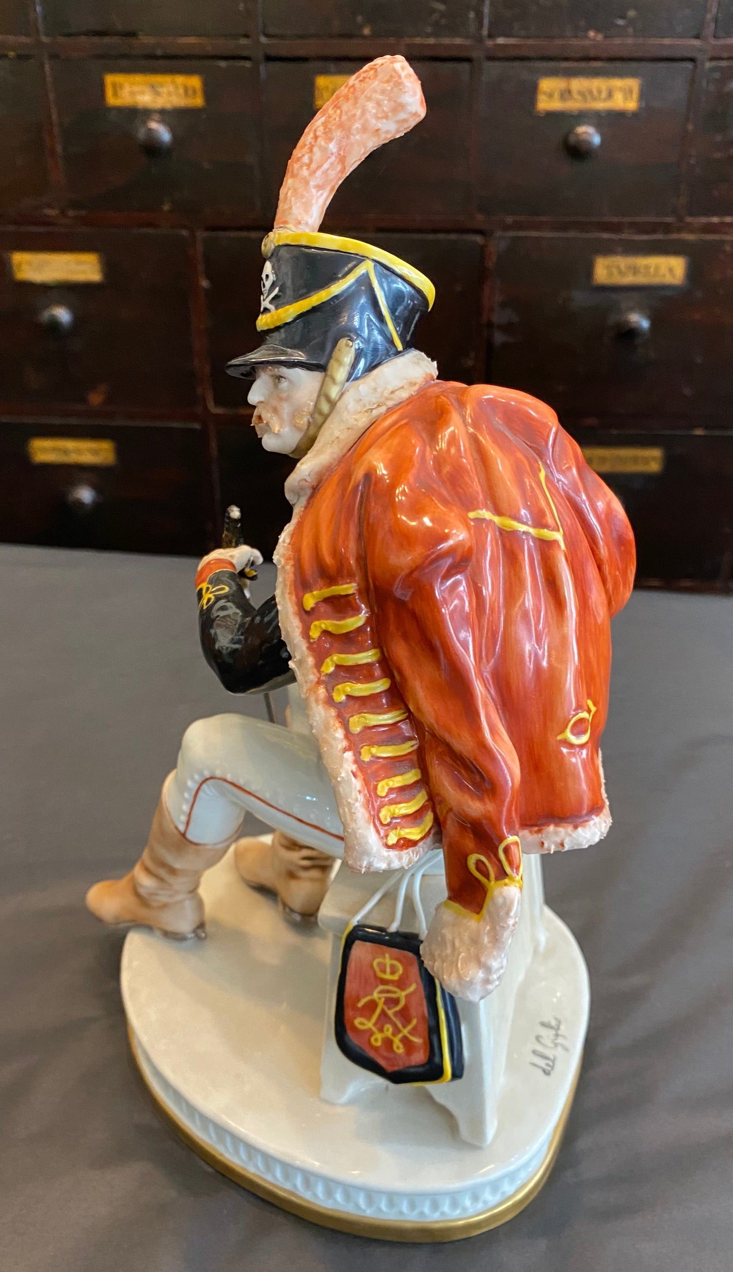 Capodimonte Soldier seated with sword